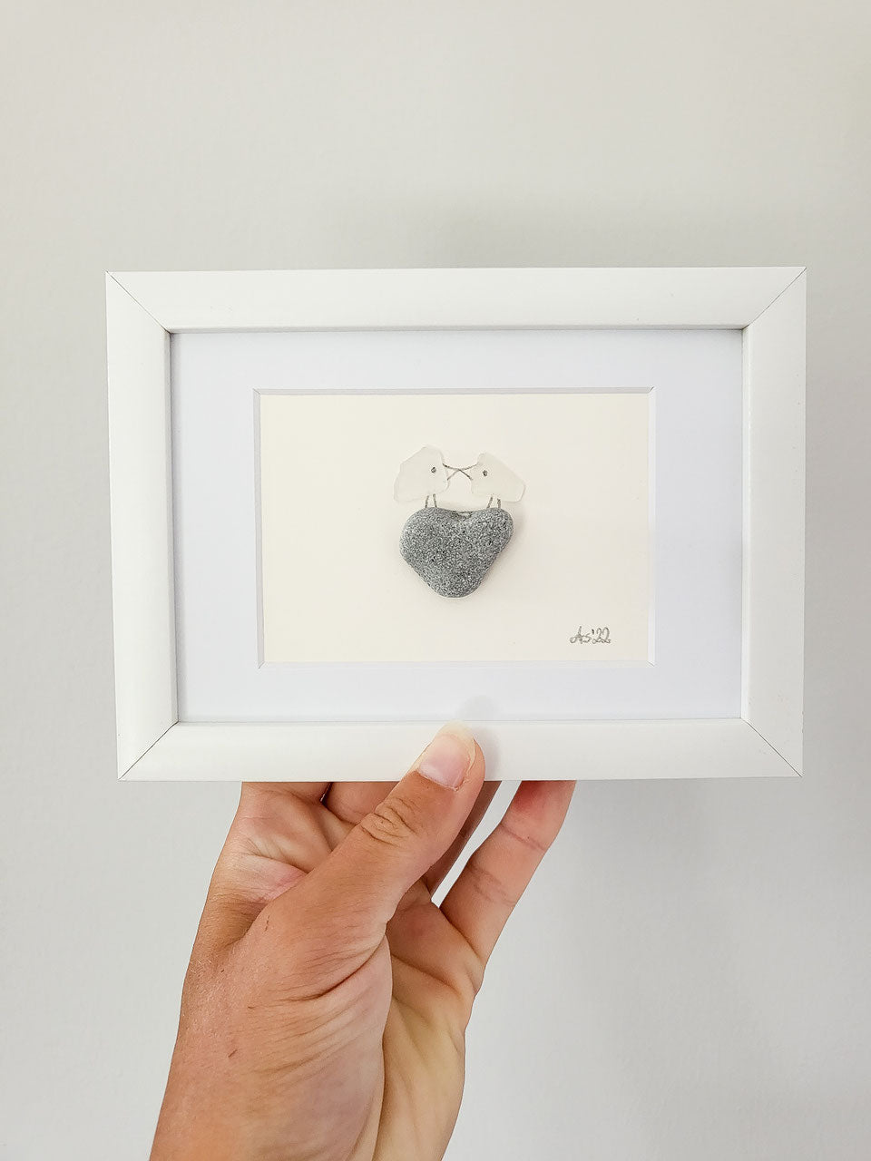 Seeglasbild Erster Kuss - mit einem Stein und echtem Seeglas aus der Ostsee